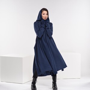 May include: A long, navy blue hooded dress with a flowing skirt. The dress is made of a soft, comfortable fabric and has a relaxed fit.