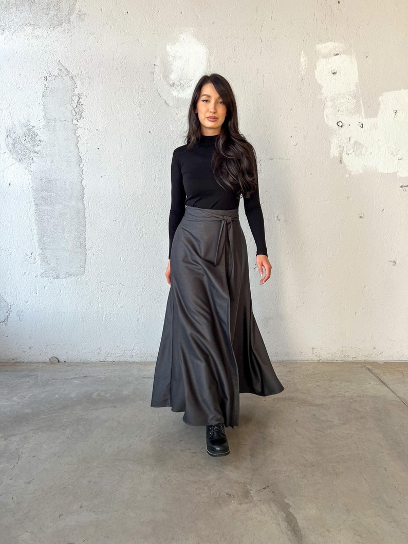 Long wool wrap skirt made from super soft fabric, featuring side pockets and an elegant, flowing design.
