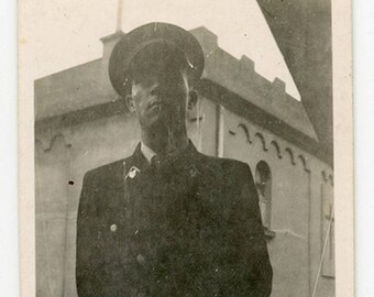 Vintage photo 'Hector' vernacular photos snapshot portrait of a man in uniform, soldier police officer military, dark stark moody,