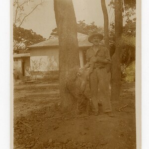 Man with a monkey - vintage photo - Congo, Africa- wild animal- around 1930- Belgian colony