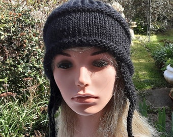 black earflap hat for women knitted in chunky acrylic yarn size medium or large