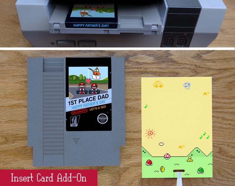 May include: An insert card add-on with a retro video game theme. The card features the text "1ST PLACE DAD HAPPY FATHER'S DAY!" and a pixelated graphic. A yellow card with a green border and cartoon graphics is also shown.