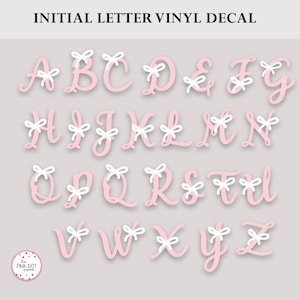 May include: Pink vinyl decal letters of the alphabet with white bows on top. The letters are in a cursive font.