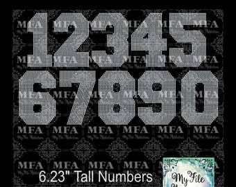 May include: A set of ten rhinestone iron-on numbers, 1 through 10, in white. The numbers are 6.23 inches tall and are designed for use with a heat press. The numbers are arranged in two rows, with the numbers 1 through 5 in the top row and the numbers 6 through 10 in the bottom row. The numbers are on a black background.