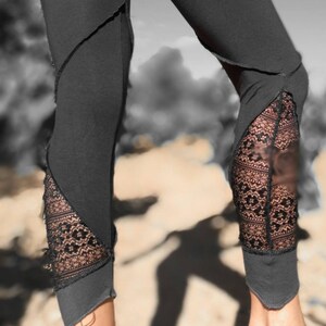 May include: Black leggings with lace detailing at the ankles. The leggings are made of a soft, stretchy fabric and have a comfortable fit.