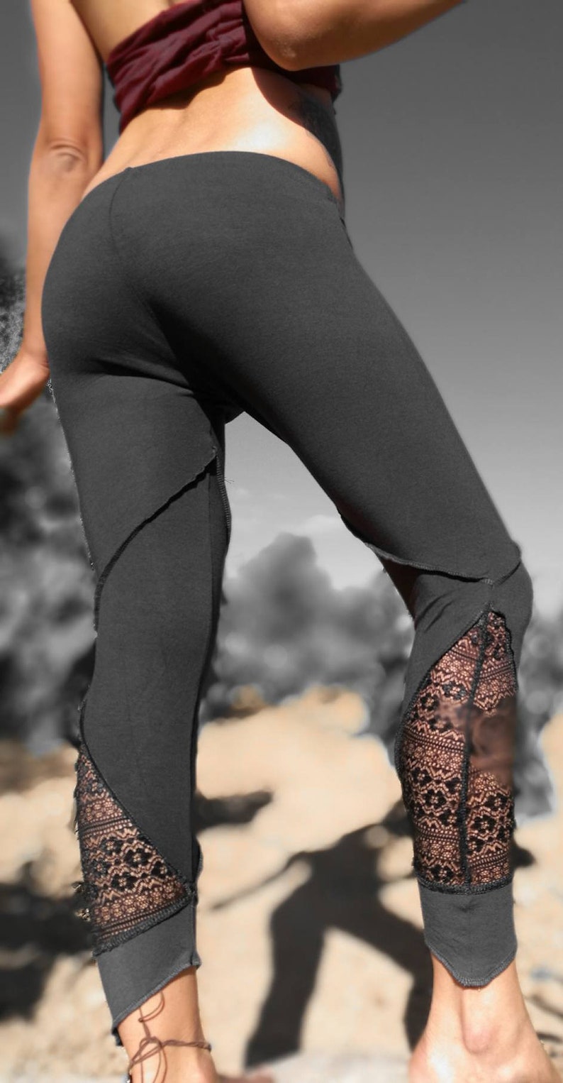 May include: Black leggings with lace detailing at the ankles. The leggings are made of a soft, stretchy fabric and have a comfortable fit.