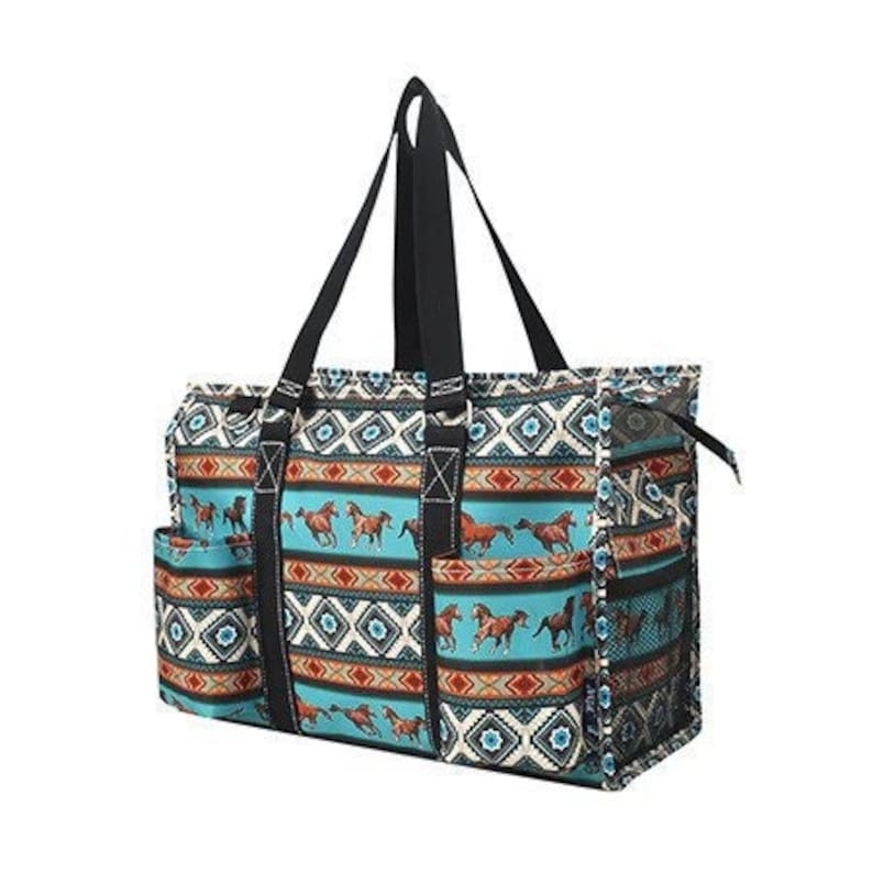 May include: A large turquoise and brown tote bag with a geometric pattern and images of horses. The bag has multiple pockets and a zipper closure.
