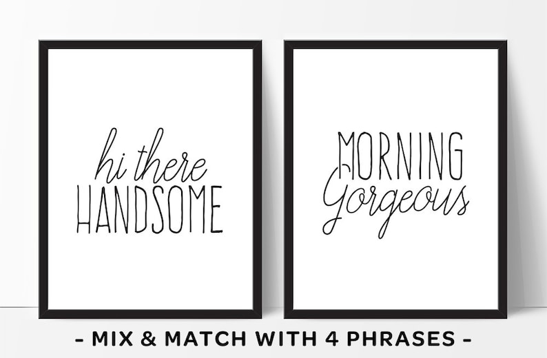 May include: Two black framed prints with white backgrounds and black text. The left print says "hi there handsome" and the right print says "morning gorgeous".