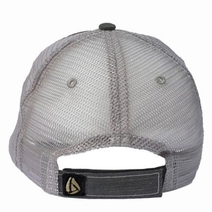 May include: Gray mesh trucker hat with a black adjustable strap and a small logo on the back.