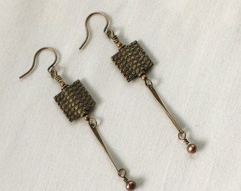 Handmade earrings featuring antique brass beads and freshwater pearls