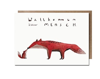 May include: A greeting card with a watercolor illustration of two red foxes. The larger fox is bending over to touch the smaller fox. The card has the text "Willkommen kleiner Mensch" in black ink.