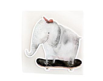 May include: A gray elephant with a red bow on its head is riding a black skateboard with white wheels.
