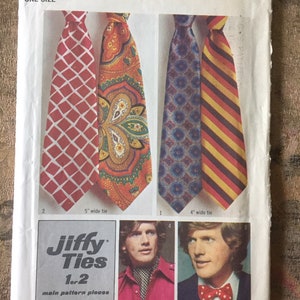 May include: Vintage Simplicity sewing pattern for Jiffy Ties, featuring four tie designs: red diamond pattern, paisley, blue floral, and yellow/red stripes. Includes instructions for 1 or 2 main pattern pieces. The pattern is one size.