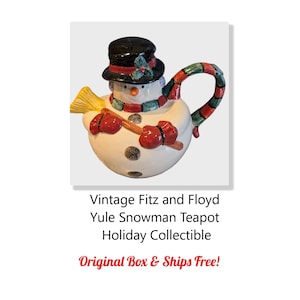 May include: A vintage Fitz and Floyd Yule snowman teapot. The teapot is white with black polka dots, a black top hat, and a red and green scarf. It has red mittens and a yellow broom. The text on the image says "Holiday Collectible".