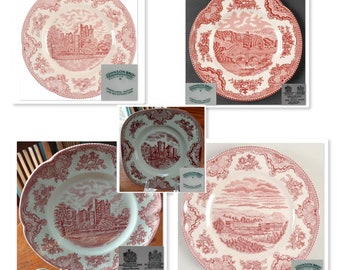 May include: Four red and white ceramic plates with a floral design and a castle scene. The plates are from Johnson Brothers Old English Castle collection.