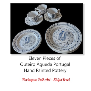 May include: Eleven-piece set of Outeiro Águeda Portugal hand-painted pottery. The set includes plates, saucers, and cups with a blue rooster and floral design on a white background. The text "Portugese Folk Art" is also visible.
