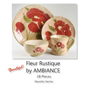May include: A rustic ceramic dinnerware set featuring a large plate, a smaller plate, a bowl, and a mug. The set is decorated with red floral designs on a beige background. The mug has a green handle. The set is from the "Fleur Rustique" collection.