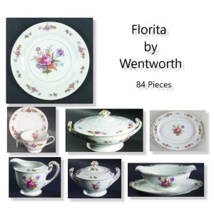 May include: A set of 84 pieces of Florita china by Wentworth. The set includes a dinner plate, a salad plate, a soup bowl, a creamer, a sugar bowl, and a gravy boat. The china is decorated with a floral pattern in shades of pink, purple, and yellow.