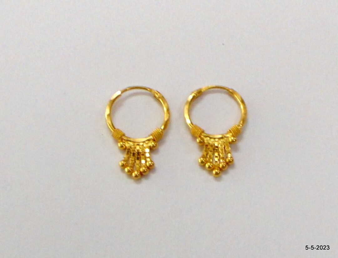 Bold gold stud earrings are the hottest trend of summer 2023