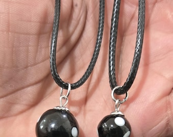 conta d'odjo and flag necklace