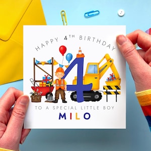 May include: A birthday card with the text "HAPPY 4TH BIRTHDAY TO A SPECIAL LITTLE BOY MILO." The card features a construction theme with a yellow excavator, a construction worker, and balloons. The number 4 is in blue.