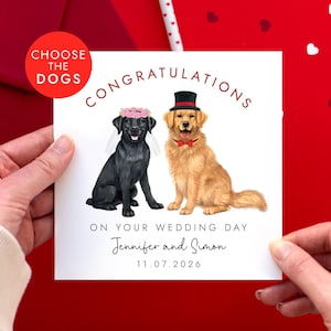 May include: A wedding card featuring illustrations of two dogs, a black Labrador and a golden retriever, dressed for a wedding. The card reads "Congratulations on your wedding day" and includes the names Jennifer and Simon, with the date 11.07.2026.