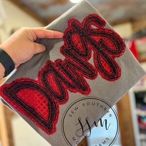 Squadre mascotte doppie impilate - applicazione - paillettes, colori della squadra. Colori comodi - vestibilità unisex