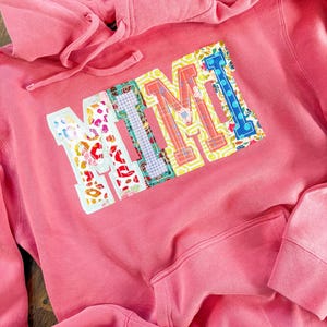 Double raggy name- hoodie- unisex sizing- fabrics will vary. NANA- mama , etc