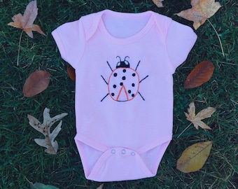 Ladybug embroidered onesie