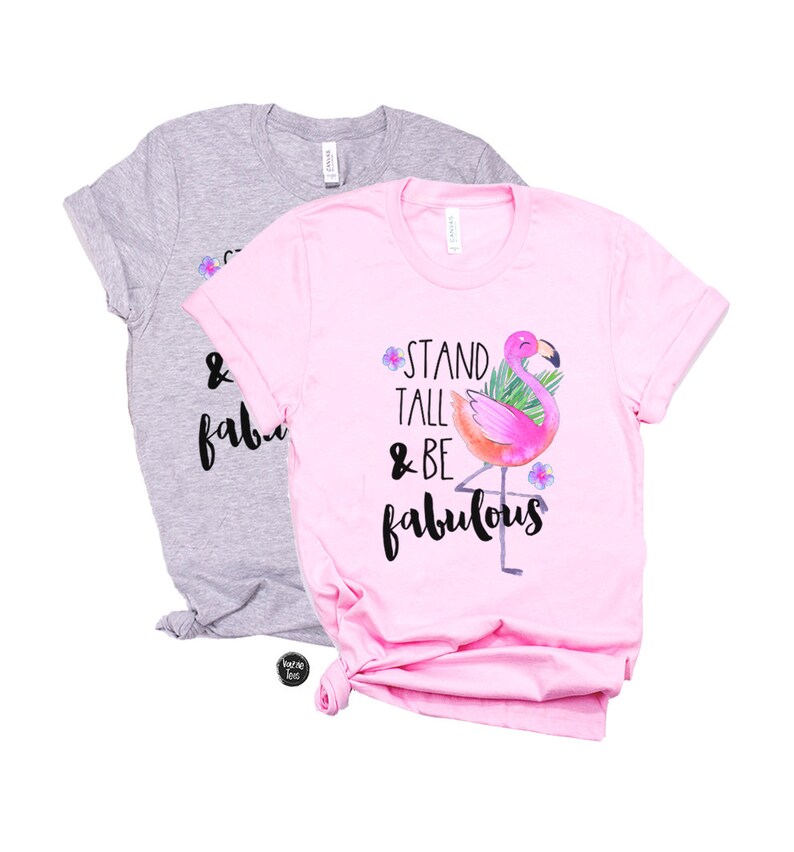 May include: Two t-shirts, one pink and one grey, with a flamingo graphic and the text "Stand Tall & Be Fabulous".