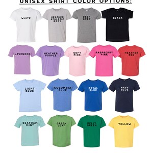 May include: A display of unisex t-shirts in various colors, including white, black, and shades of gray, purple, pink, red, blue, green, and yellow. Each shirt has the color name printed in black. The text "UNISEX SHIRT COLOR OPTIONS" is at the top.