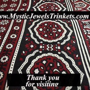 May include: A close-up of a red and white patterned fabric with a black background. The fabric has a traditional design with intricate details. The text "www.MysticJewelsTrinkets.com" is visible at the top of the image. The text "Thank you for visiting" is visible at the bottom of the image.