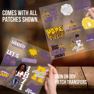 May include: Iron-on DTF patch transfers featuring various designs with text and graphics. The patches include phrases like "DOPE," "BIG GRAD ENERGY," and "LET'S GO," along with the text "Alcorn State" and the number "1871." The patches are in purple, yellow, and white.