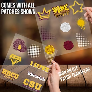May include: A set of iron-on patches featuring various designs, including a crown, a diamond, a rose, a heart, and the words "HBCU Made", "I Love", "'hbcu-ish", and "CSU". The patches are on clear sheets and are ready to be ironed onto fabric.
