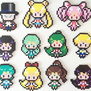 Sailor Scouts: Sailor Moon/Chibi Moon, Tuxedo Mask, Sailor Mercury/ Mars/Jupiter/Venus, Sailor Uranus/Neptune/Pluto/Saturn