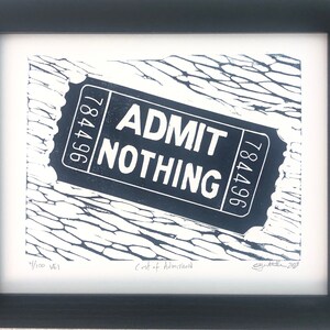 May include: A black and white print of a ticket that says "ADMIT NOTHING" with the number 784796 on it. The ticket is lying on a textured surface. The print is signed and numbered 4/100.