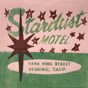 May include: A pink and green vintage motel sign with the text "Stardust Motel" and the address "1200 Pine Street Redding, Calif."