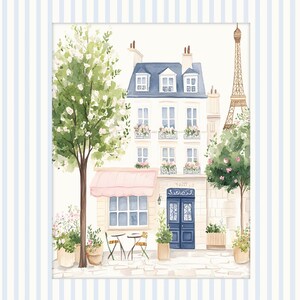 May include: A watercolor painting of a Parisian street scene with a cafe, a building, and the Eiffel Tower in the background. The cafe has a pink awning and a table with two chairs. There are trees and flowers in the scene.