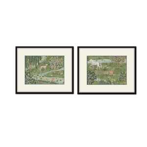 May include: Two framed prints of whimsical illustrations depicting a green forest scene with a white horse and a dog. The prints are set against a white background.