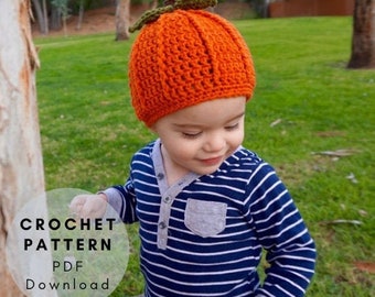 May include: A crochet pattern for a pumpkin hat. The pattern is available as a PDF download. The image shows a child wearing the hat.