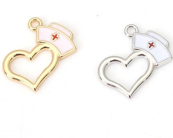 May include: Two gold and silver heart-shaped charms with a white nurse's hat with a red cross on top.