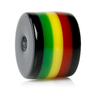 May include: A round, black, green, yellow, and red striped bead with a hole in the center.