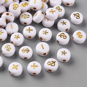 May include: White round beads with gold symbols, including dollar signs, plus signs, asterisks, and the letter "I".