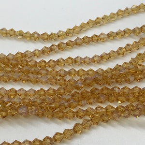 100 4mm Bicone Brown Beads
