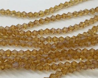 100 4mm Bicone Brown Beads