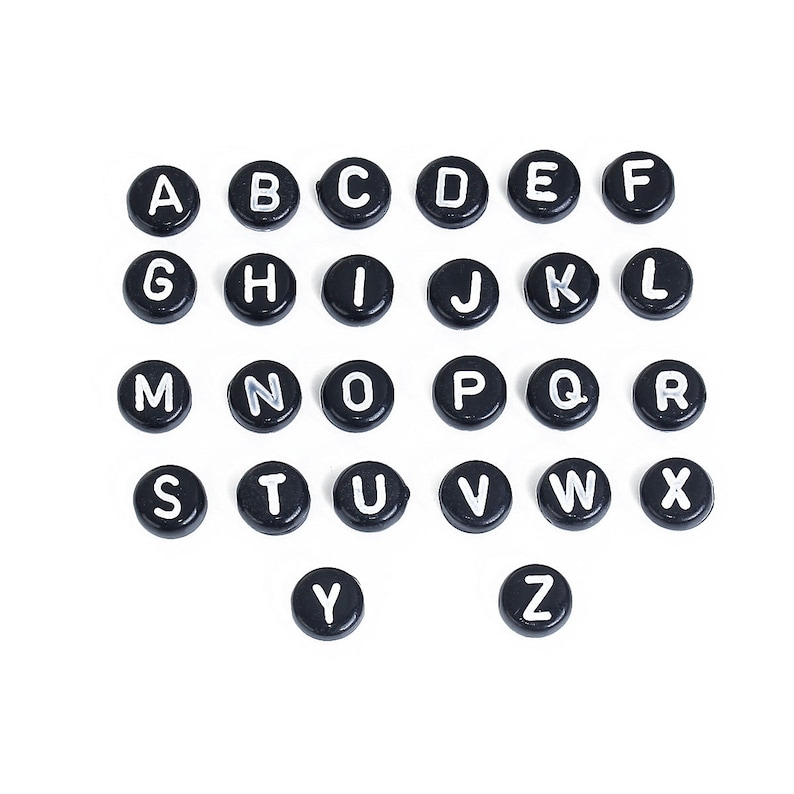 May include: Black alphabet letter beads with white lettering. The beads are arranged in alphabetical order from A to Z.