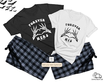 May include: Matching black and white pajama set with a skeleton hand heart graphic and the text "Forever Hers" and "Forever His" with a date.