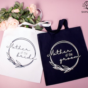 Wedding gift tote bag for parents: personalized heavy canvas tote with ‘Mother of the Bride’ and ‘Mother of the Groom’ printed designs, perfect thank you gift for wedding day and bridal party keepsake.
