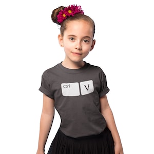 May include: A dark gray t-shirt with a white graphic of the computer keys 'ctrl' and 'V'.