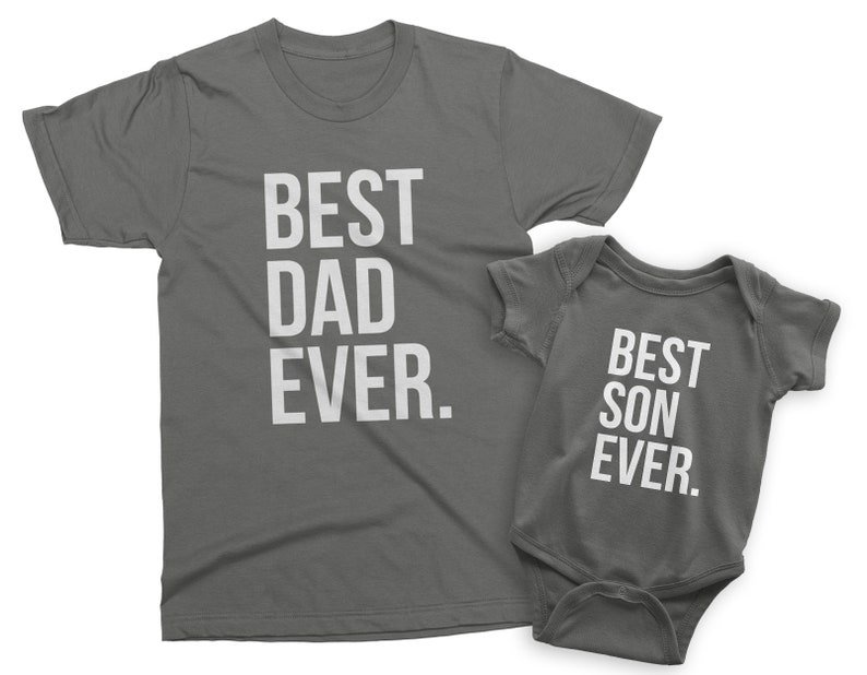 May include: A gray t-shirt with the text "Best Dad Ever." and a gray baby bodysuit with the text "Best Son Ever."